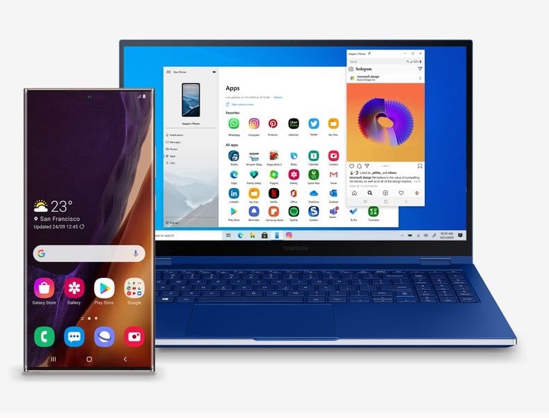Samsung phone next to open PC laptop with a blue keyboard