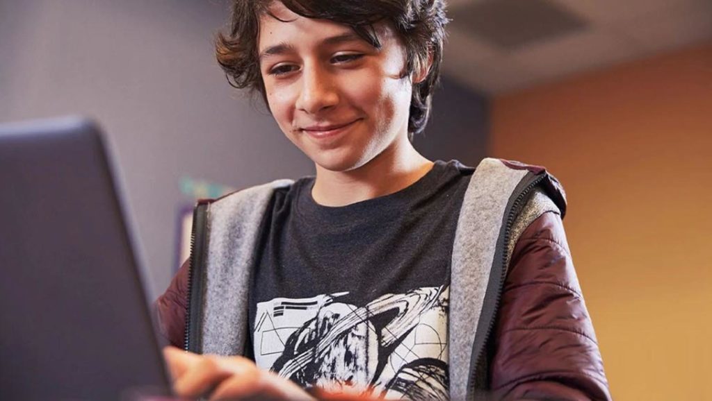 Teenage boy using a laptop computer