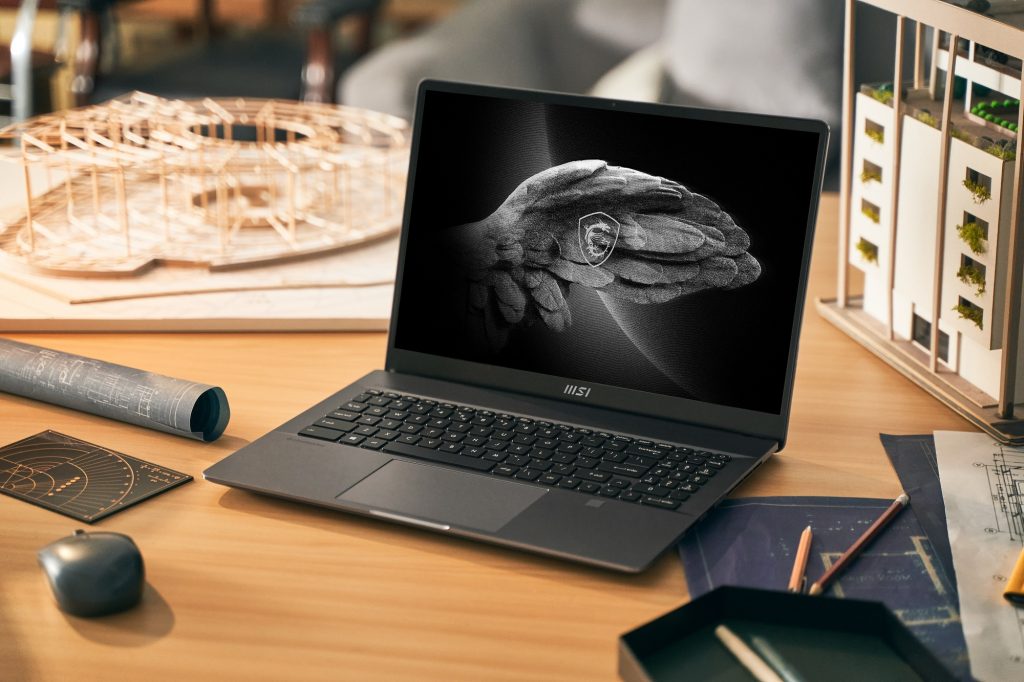 MSI laptop open on a desk MSI laptop open on a desk