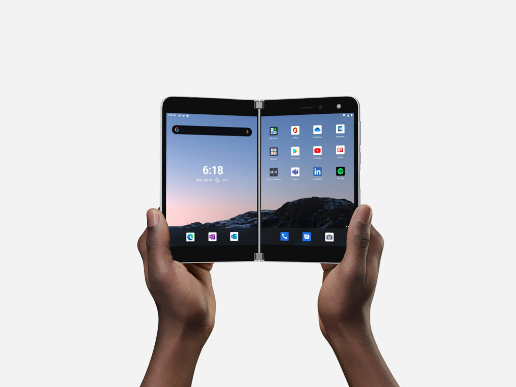 Two hands holding a Surface Duo Two hands holding a Surface Duo